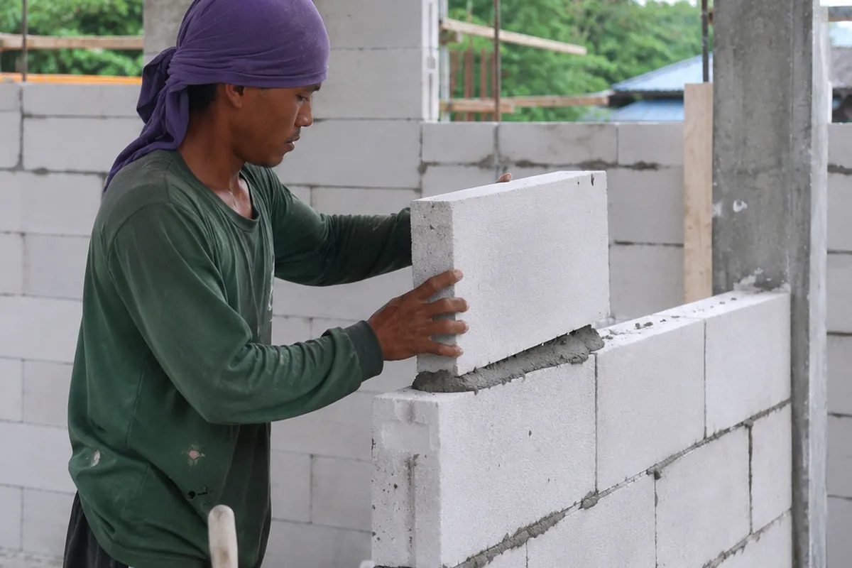 Block walls being laid on a construction site