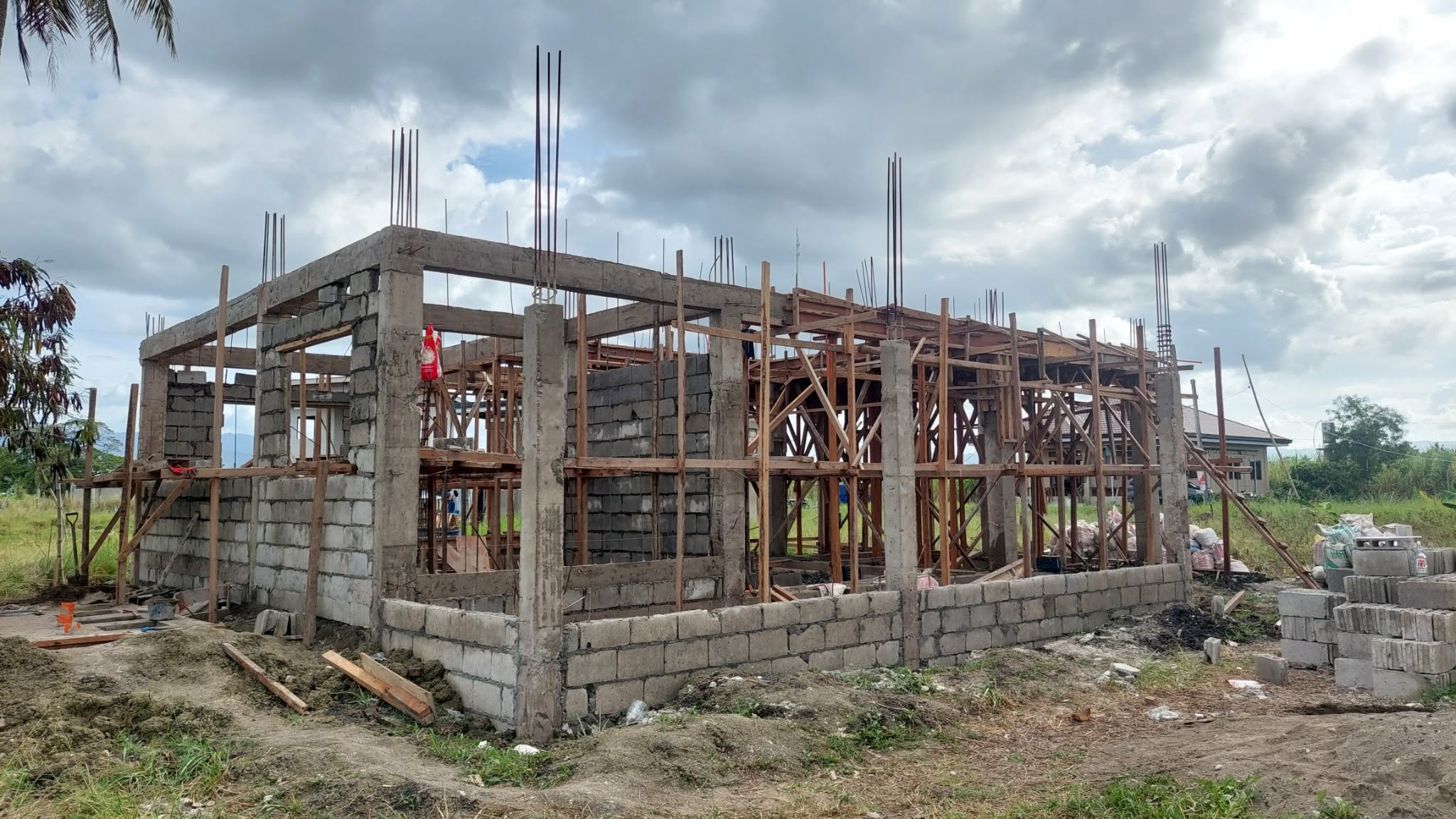 House under renovation in the Philippines — columns, walls and ongoing construction work