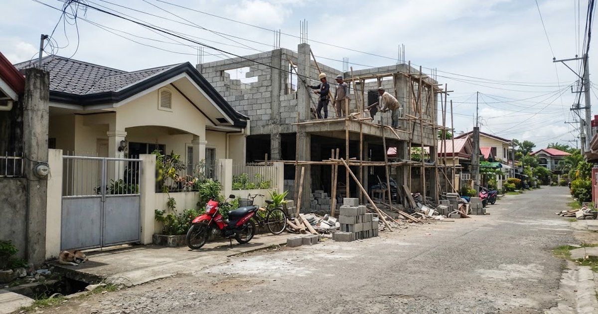Finished bungalow next to a two-storey house under construction