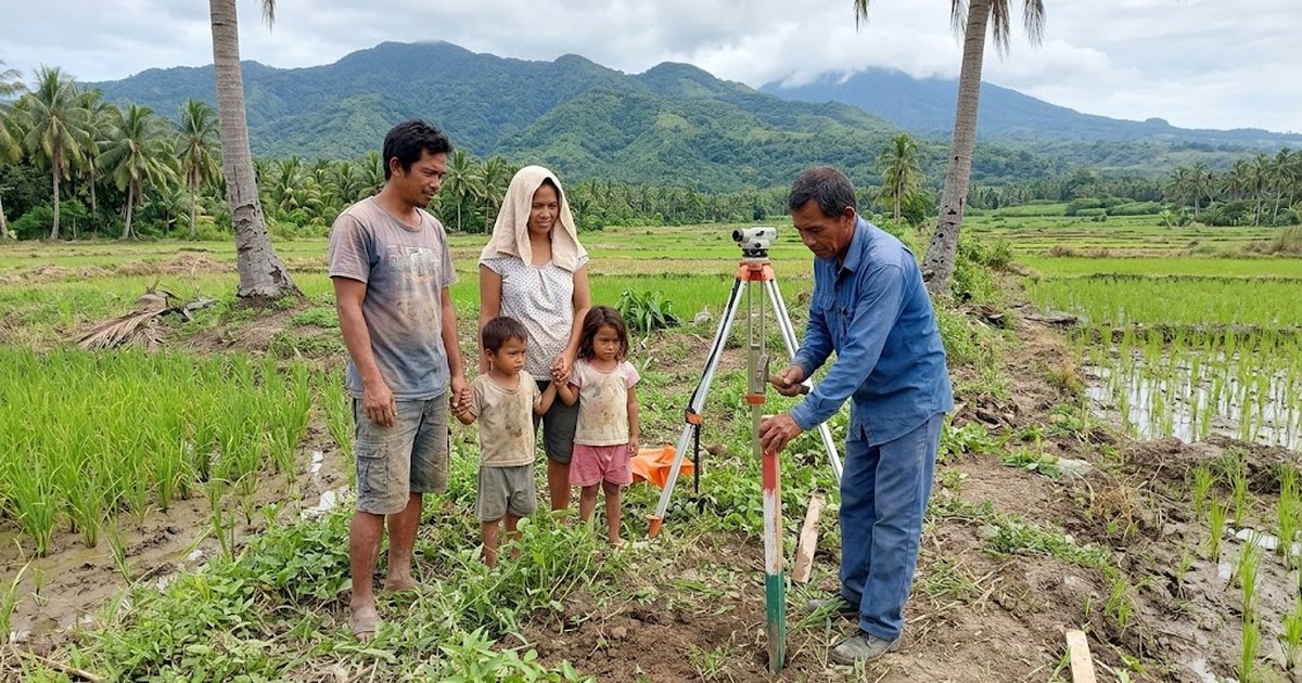 Filipino family and a land surveyor standing on a coconut and rice farm lot in Negros Oriental, marking a corner for a future house