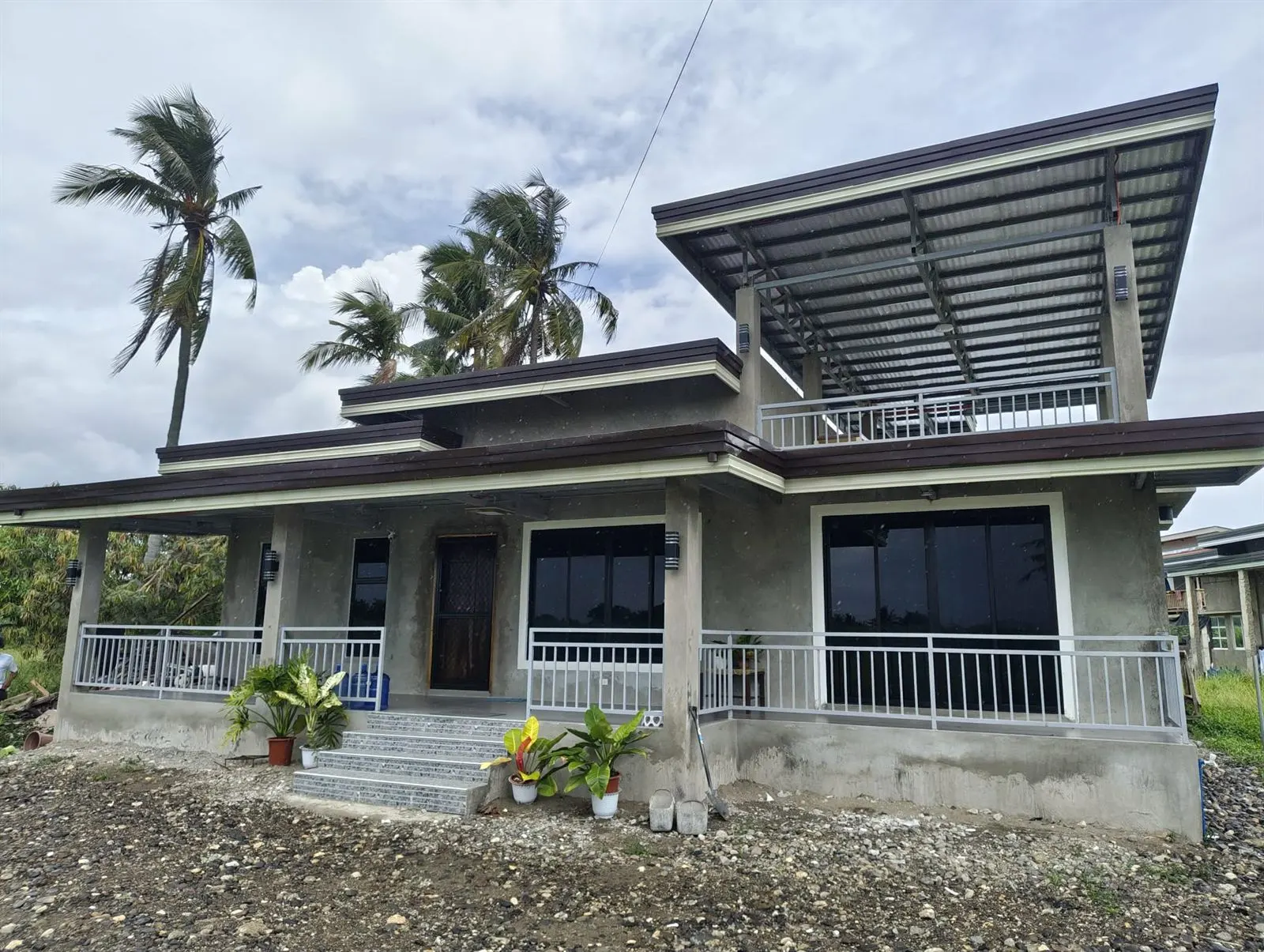Single-detached house on its lot showing the open yard between building and property line