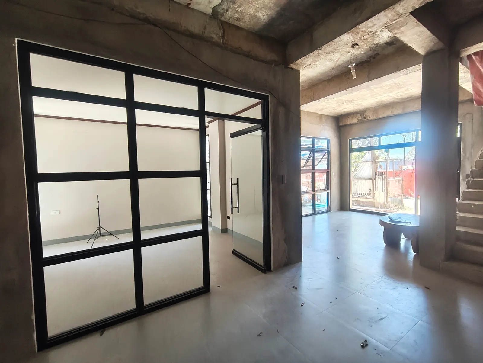 Interior view with glass partition wall and open lobby space at the GAD Building — Manjuyod