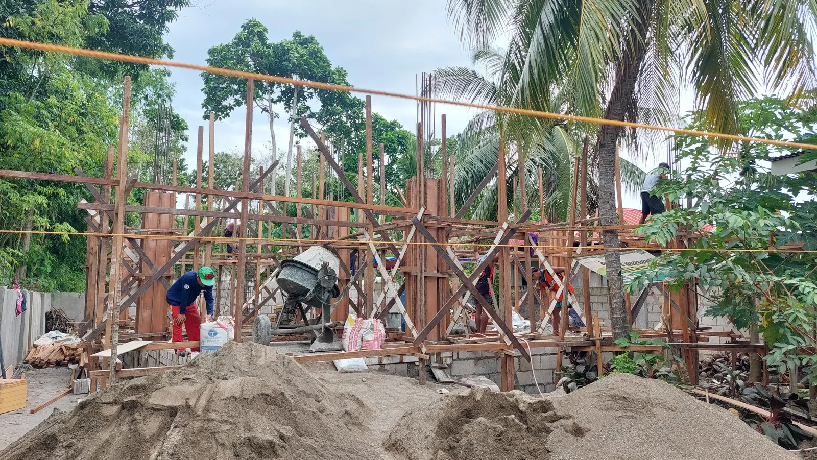 House under construction Philippines — columns and CHB walls